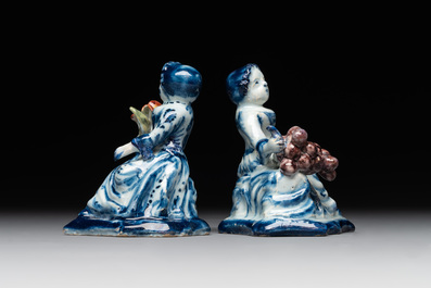 A pair of polychrome Dutch Delft groups of merchant ladies, 18th C.