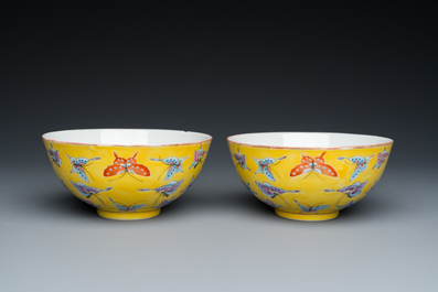 A pair of Chinese famille rose yellow-ground 'butterfly' bowls, Tongzhi mark, 20th C.