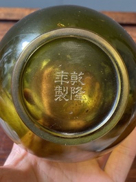 A rare Chinese translucent green Peking glass bottle vase, Qianlong mark and of the period