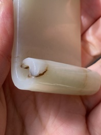 Two fine Chinese white and celadon jade brush rests, Qing