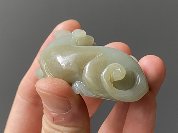 A Chinese celadon jade carving of a lion with cub and a white jade carving of a goose, Qing
