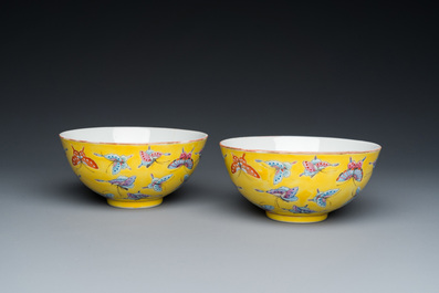 A pair of Chinese famille rose yellow-ground 'butterfly' bowls, Tongzhi mark, 20th C.