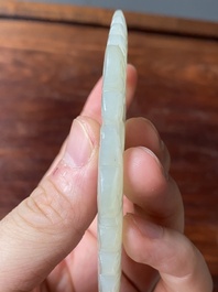 Four Chinese white, celadon and russet jade pendants, Qing/Republic