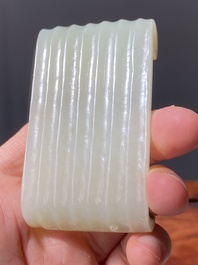 Two fine Chinese white and celadon jade brush rests, Qing