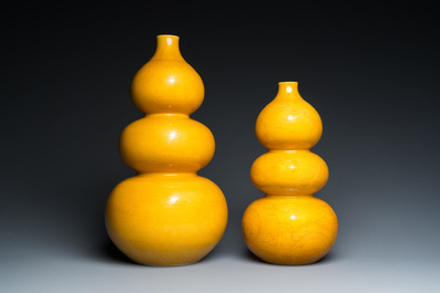 Two Chinese incised yellow-glazed triple gourd vases with dragons and lotus scrolls, Longqing mark, 20th C.