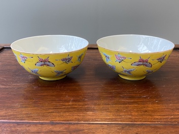 A pair of Chinese famille rose yellow-ground 'butterfly' bowls, Tongzhi mark, 20th C.