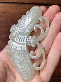 Four Chinese white, celadon and russet jade pendants, Qing/Republic