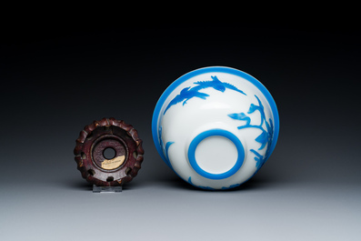 A Chinese blue-overlay white Beijing glass 'meiping' vase, a bowl and a bottle, 19/20th C.