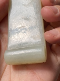 Two fine Chinese white and celadon jade brush rests, Qing