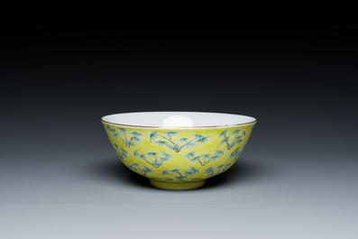A Chinese blue and white bowl with floral design and a famille verte yellow-ground 'bamboo' bowl, Tongzhi mark, 18/19th C.