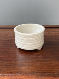 A Chinese Dehua blanc de Chine tripod censer, Kangxi