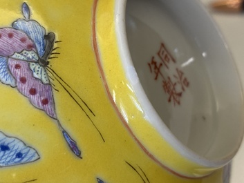 A pair of Chinese famille rose yellow-ground 'butterfly' bowls, Tongzhi mark, 20th C.