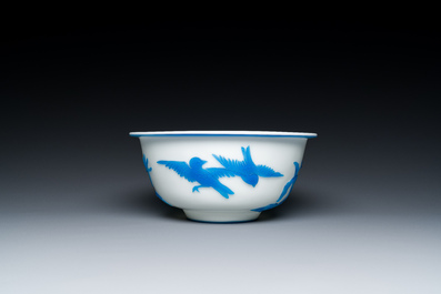 A Chinese blue-overlay white Beijing glass 'meiping' vase, a bowl and a bottle, 19/20th C.