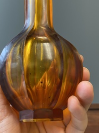 A Chinese facetted translucent amber-coloured Peking glass bottle vase, Qianlong mark, 19th C.