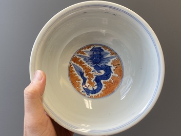 A Chinese famille rose bowl, a 'peaches' plate, a blue and white and iron-red bowl and a 'phoenix' plate, Wanli and Jiaqing marks, 19th C.