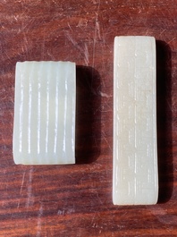 Two fine Chinese white and celadon jade brush rests, Qing