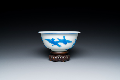 A Chinese blue-overlay white Beijing glass 'meiping' vase, a bowl and a bottle, 19/20th C.