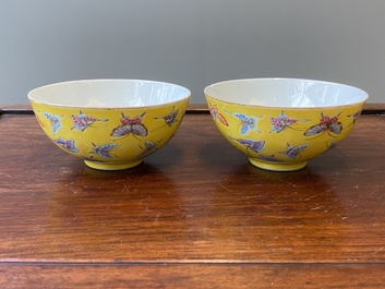 A pair of Chinese famille rose yellow-ground 'butterfly' bowls, Tongzhi mark, 20th C.