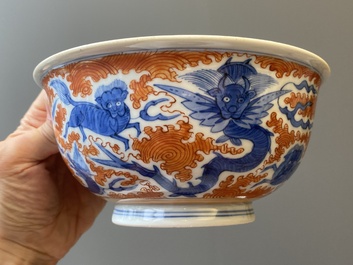 A Chinese famille rose bowl, a 'peaches' plate, a blue and white and iron-red bowl and a 'phoenix' plate, Wanli and Jiaqing marks, 19th C.