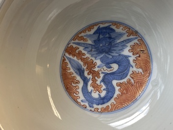 A Chinese famille rose bowl, a 'peaches' plate, a blue and white and iron-red bowl and a 'phoenix' plate, Wanli and Jiaqing marks, 19th C.