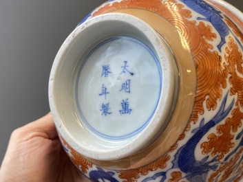 A Chinese famille rose bowl, a 'peaches' plate, a blue and white and iron-red bowl and a 'phoenix' plate, Wanli and Jiaqing marks, 19th C.