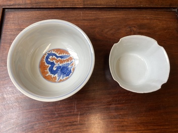 A Chinese famille rose bowl, a 'peaches' plate, a blue and white and iron-red bowl and a 'phoenix' plate, Wanli and Jiaqing marks, 19th C.
