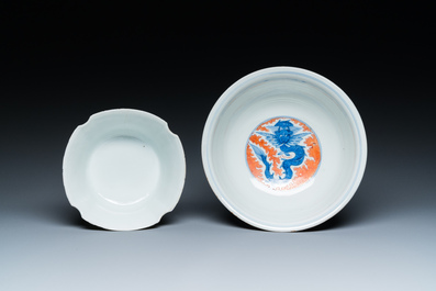 A Chinese famille rose bowl, a 'peaches' plate, a blue and white and iron-red bowl and a 'phoenix' plate, Wanli and Jiaqing marks, 19th C.