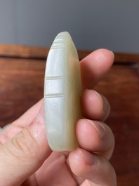 Four Chinese white, celadon and russet jade pendants, Qing/Republic