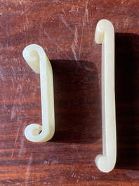 Two fine Chinese white and celadon jade brush rests, Qing