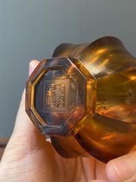 A Chinese facetted translucent amber-coloured Peking glass bottle vase, Qianlong mark, 19th C.
