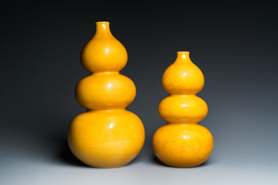 Two Chinese incised yellow-glazed triple gourd vases with dragons and lotus scrolls, Longqing mark, 20th C.