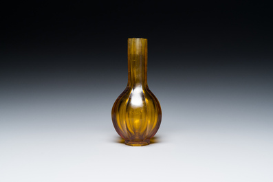 A Chinese facetted translucent amber-coloured Peking glass bottle vase, Qianlong mark, 19th C.