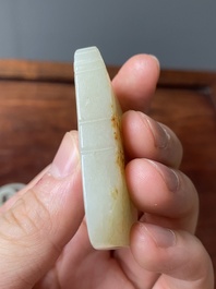 Four Chinese white, celadon and russet jade pendants, Qing/Republic