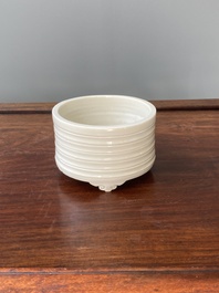 A Chinese Dehua blanc de Chine tripod censer, Kangxi