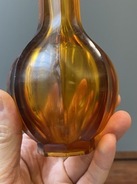 A Chinese facetted translucent amber-coloured Peking glass bottle vase, Qianlong mark, 19th C.
