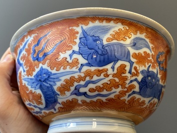 A Chinese famille rose bowl, a 'peaches' plate, a blue and white and iron-red bowl and a 'phoenix' plate, Wanli and Jiaqing marks, 19th C.