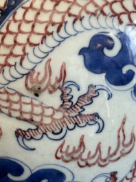 A Chinese blue, white and copper-red 'dragon and phoenix' vase, 19th C.