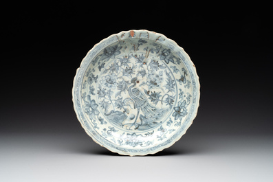 A Chinese blue and white 'phoenix' dish and two 'Buddhist lion' and 'peony' plates, Hongzhi/Zhengde