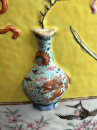 A Chinese famille rose yellow-ground relief-molded 'antiquities' fish bowl, Zhengde mark, 19th C.