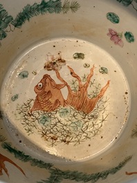 A Chinese famille rose yellow-ground relief-molded 'antiquities' fish bowl, Zhengde mark, 19th C.