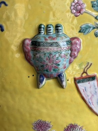 A Chinese famille rose yellow-ground relief-molded 'antiquities' fish bowl, Zhengde mark, 19th C.