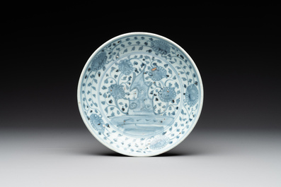 A Chinese blue and white 'phoenix' dish and two 'Buddhist lion' and 'peony' plates, Hongzhi/Zhengde