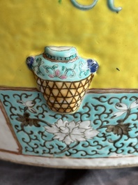 A Chinese famille rose yellow-ground relief-molded 'antiquities' fish bowl, Zhengde mark, 19th C.
