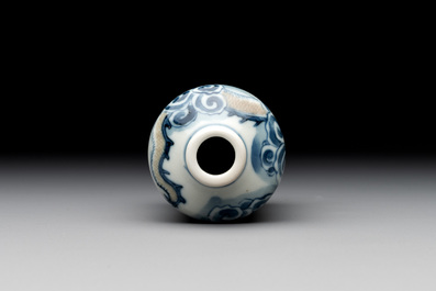 A large Chinese blue, white and copper-red 'zodiac' snuff bottle, squirrel mark, 19th C.