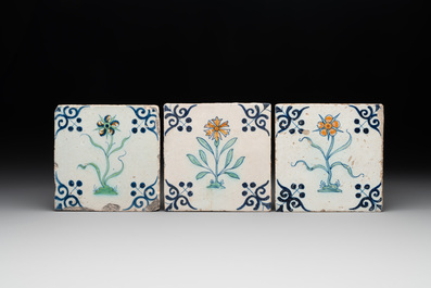 Five polychrome Dutch Delft 'flower' tiles, 17th C.