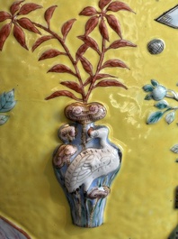 A Chinese famille rose yellow-ground relief-molded 'antiquities' fish bowl, Zhengde mark, 19th C.