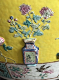 A Chinese famille rose yellow-ground relief-molded 'antiquities' fish bowl, Zhengde mark, 19th C.