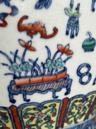 A Chinese doucai 'antiquities' 'hu' vase, Qianlong mark, 19th C.