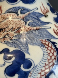A Chinese blue, white and copper-red 'dragon and phoenix' vase, 19th C.