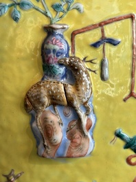 A Chinese famille rose yellow-ground relief-molded 'antiquities' fish bowl, Zhengde mark, 19th C.